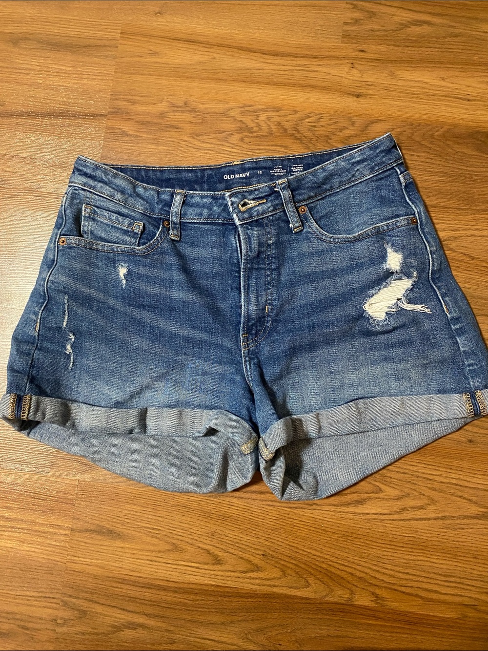 ✨8/$10. Old Navy Medium Blue Distressed Roll-Cuff Denim Shorts. Size 12